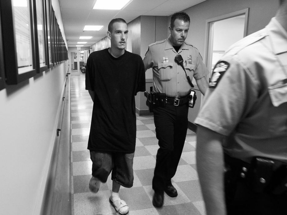 First Place, News Picture Story - Amy E. Voigt / The (Toledo) BladeStephen King is walked through the safety building after being arrested in connection to the missing toddler Elaina Steinfurth on July 20, 2013.