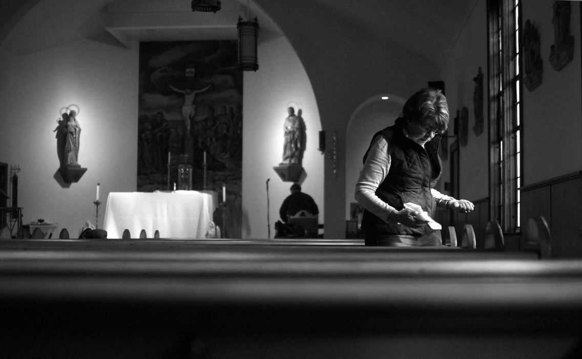 First Place, James R. Gordon Ohio Undertanding Award - Jacob Byk / Kent State UniversityCheryl Luckner cleans Christmas decorations inside Our Lady of Consolation, the only church in Nemacolin, in January 2013. The church, as old as the town itself, is losing money because most of its congregation lives outside Nemacolin. Some predict it will close in the coming years. 