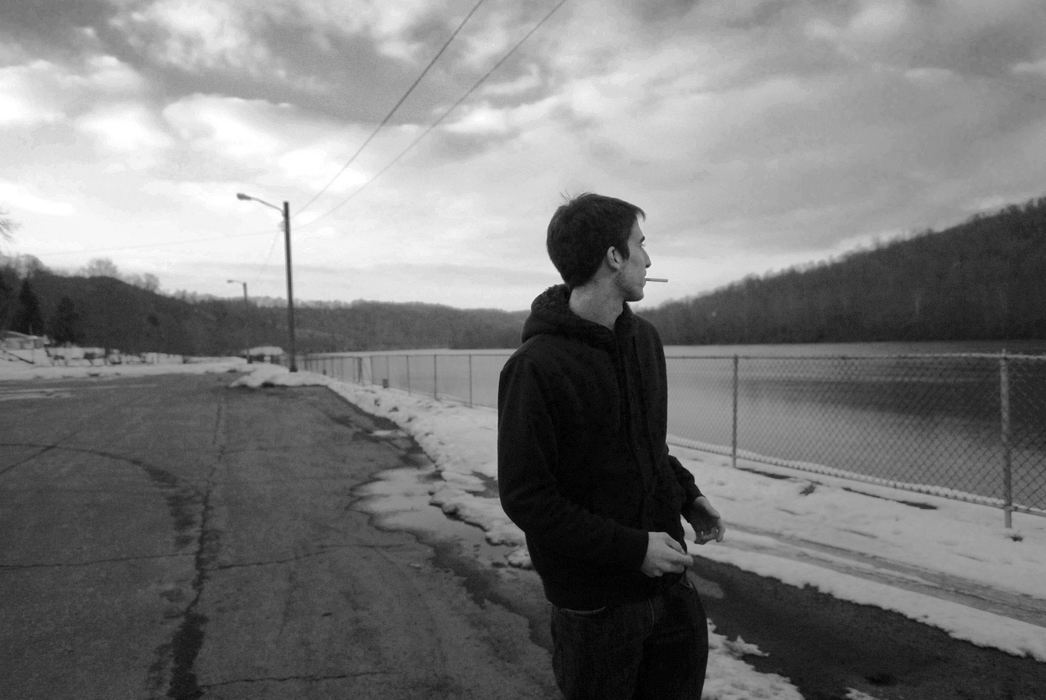First Place, James R. Gordon Ohio Undertanding Award - Jacob Byk / Kent State UniversityChristian Berardi, a sophomore nursing major at Waynesburg University, looks out at the Monongahela River in January 2013 from an empty parking lot in a bitter wind in Crucible, Pa.  
