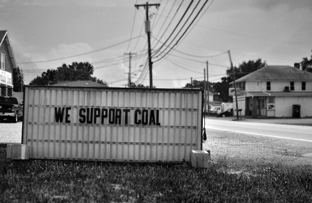 First Place, James R. Gordon Ohio Undertanding Award - Jacob Byk / Kent State UniversityThe Fracturing of Greene County is a cultural immersion documentary that depicts the changing face of energy in the southwestern corner of Pennsylvania. This project began in Youngstown, Ohio, as a story about natural gas but the effect of mining natural gas as a substitute for coal was most evident in the heart of coal country. Here, the direct effect of change can be seen in the coal community. Despite this new source of energy, the quality of life for the residents of Greene County did not improve. They continue to struggle with poverty and lack of opportunity, but now there is an added pressure that comes with change. As a result, there is a subtle, but important cultural shift that is taking place in the community. There is a deeper connection between the residents and a strong desire to preserve as much of their traditional way of life as possible.The community and the coal industry have been interconnected for decades, but this will change. The Fracturing of Greene County aims to depict this traditional way of life as natural gas replaces coal as a primary source of revenue for its residents.Image 01: A sign outside the Fairfield Inn in Carmichaels, PA is placed on a main roadway before the closing of Hatfield Ferry Power Station, a coal-fired power plant and one of the largest in western Pennsylvania. Hatfield closed in October 2013. Over the course of two years, coal has significantly declined and natural gas has risen.
