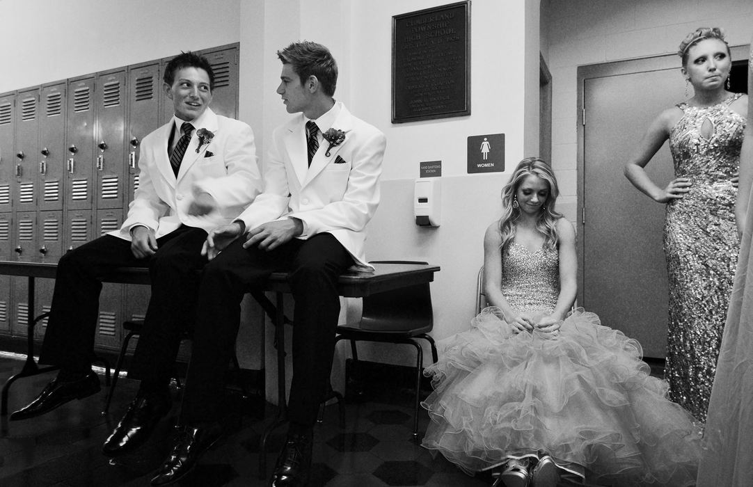 First Place, James R. Gordon Ohio Undertanding Award - Jacob Byk / Kent State UniversityMorgan Miller (center), a 17-year-old candidate for the 59th Annual Bituminous Coal Queen Pageant sits backstage at Carmichaels High School with Colton Henry and Josh Mundell, two members of the Queen Court, in August 2012. The pageant is part of the King Coal Festival, a weeklong celebration every summer that honors coal mining culture in southwestern Pennsylvania. It has taken place in Carmichaels, (the closest town to Nemacolin) since it’s creation.