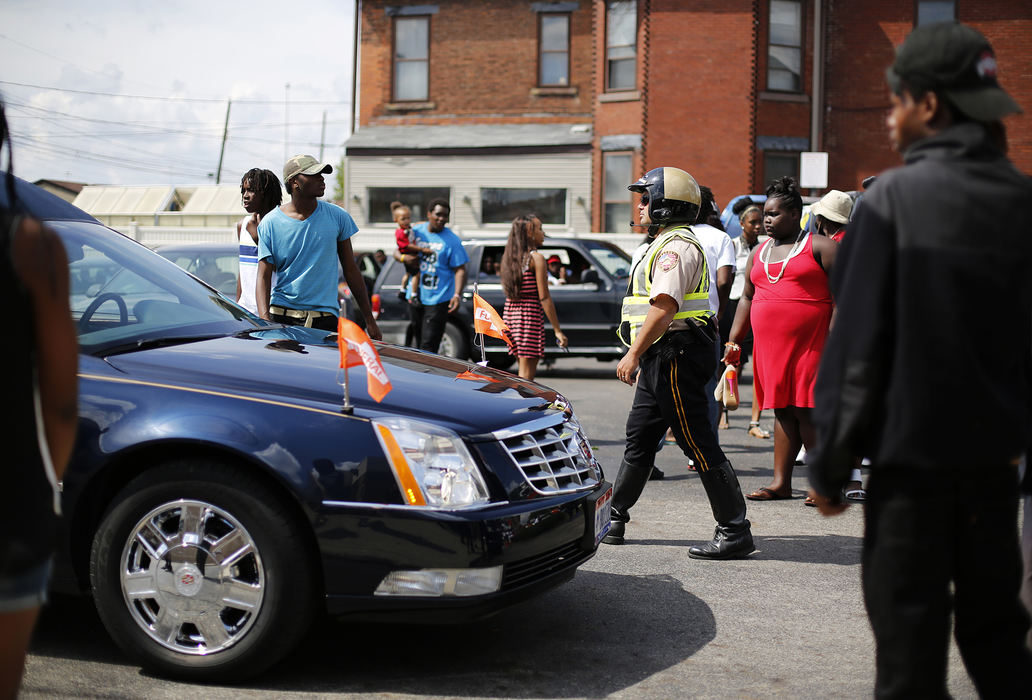 Second Place, James R. Gordon Ohio Undertanding Award - Eamon Queeney / The Columbus DispatchFriends and family get ready to leave the viewing of Lamont Frazier, a 17-year-old from the South Side shot and killed by Devonere Simmonds and Nathaniel Brunner on July 25, to head to his burial, Thursday afternoon, August 1, 2013. 
