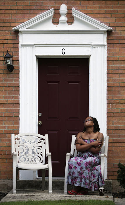 Second Place, James R. Gordon Ohio Undertanding Award - Eamon Queeney / The Columbus DispatchEbony Crosby embraces herself in front of her home off Livingston Avenue on the East Side of Columbus as she reflects after speaking with reporters about her 16-year-old son Lee-Divine McCrae, Monday afternoon, August 12, 2013. Crosby's son Lee-Divine was shot in the leg in March of this year after someone began shooting outside of Walnut Ridge High School. Crosby worries that a whole generation of young boys will kill each other and there will be no one for her daughters to grow up and love.“I wish I could wrap my arms around all these little boys and let them know somebody loves them. Because I think at this point in life, they think nobody cares.” 