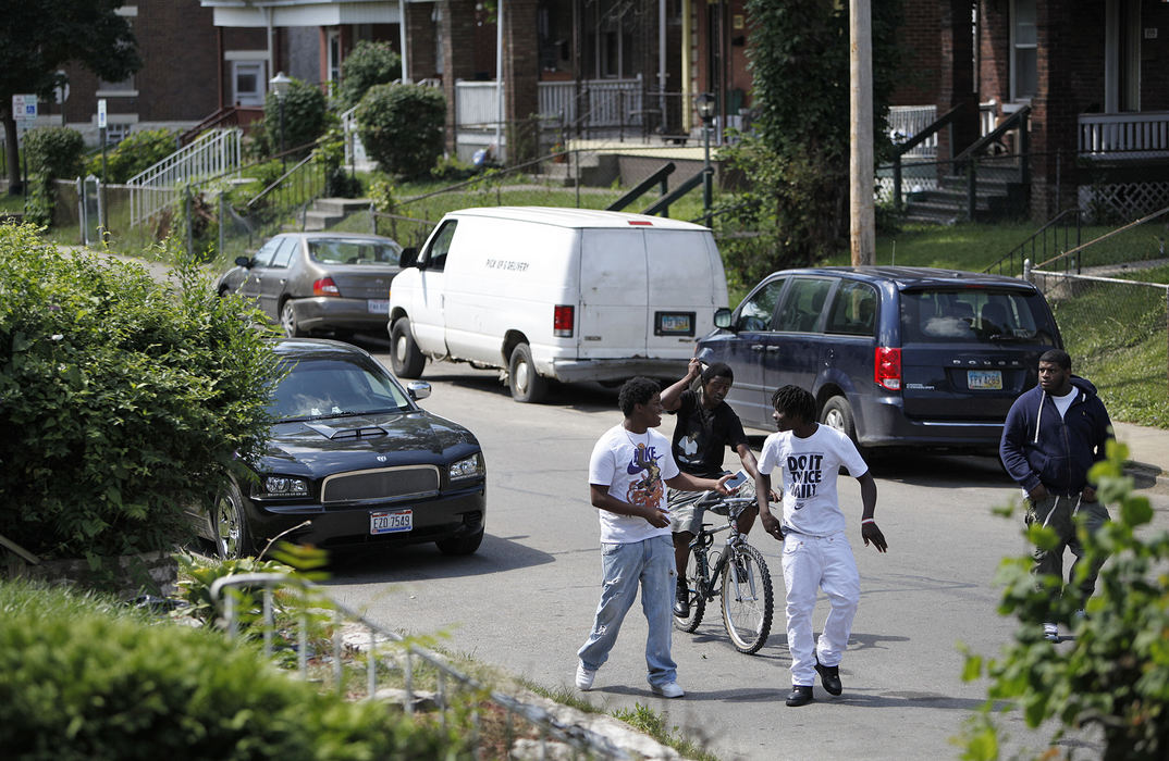 Second Place, James R. Gordon Ohio Undertanding Award - Eamon Queeney / The Columbus DispatchTeenagers walk down Linwood Avenue on the South Side, Friday morning, August 16, 2013. An 42-block area on the South Side plagued with shootings and nicknamed Soufganistan by the youth there went almost 2 years with no deaths until this summer. 