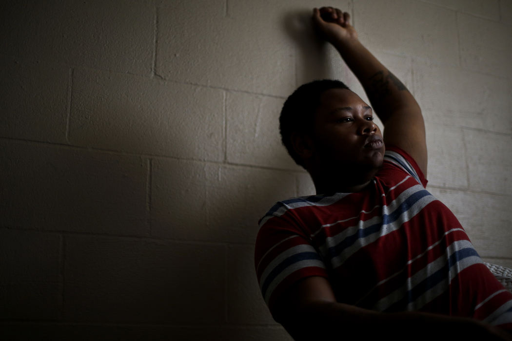 Second Place, James R. Gordon Ohio Undertanding Award - Eamon Queeney / The Columbus DispatchAntwan Milton, 15, talks to reporters in the basement of the North Linden home he lives in with his cousin and other family, Wednesday afternoon, August 14, 2013. Milton was shot in uncle's home but says he doesn't know how it happened. No one has been charged, and the gun was never found. The bullet went through his left wrist, scaring the P in his RIP Antwan tattoo in memory of his father who was killed last year, and lodged in his skull. Milton said he is not afraid of guns. Some teens need to have guns, he said, so “they can kill or scare” their enemies. 