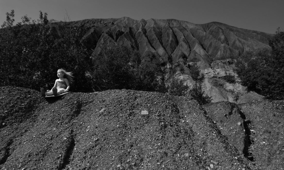 First Place, James R. Gordon Ohio Undertanding Award - Jacob Byk / Kent State UniversityZoe Baker sleds down the fragments of coal, slate rock and brick that compile "the mound,” a century-old pile of coal waste that has been accumulating since the Nemacolin mine opened in 1920. The pile has been left behind since the mine closed forever in 1978, and generations of families in the area have used it for recreation since it's creation.