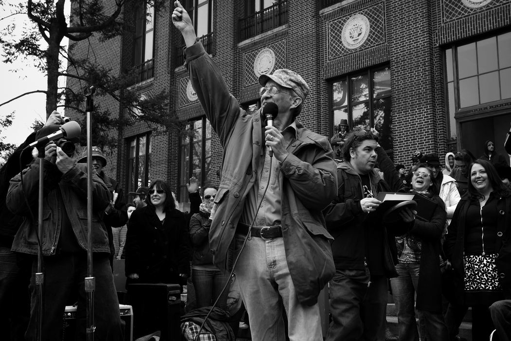 First Place, Photographer of the Year - Large Market - Katie Rausch / The (Toledo) BladeMedical marijuana activist Tim Beck hoists a joint up as he addresses the hundreds of people assembled for, "Hash Bash," an annual gathering of marijuana rights supporters, in Ann Arbor, Mich. Beck has been working to legalize marijuana in the state of Michigan for more than a decade, and has been a major force behind the passage of the state's medical marijuana legislation. "Marijuana legalization is inevitable," Beck said. 