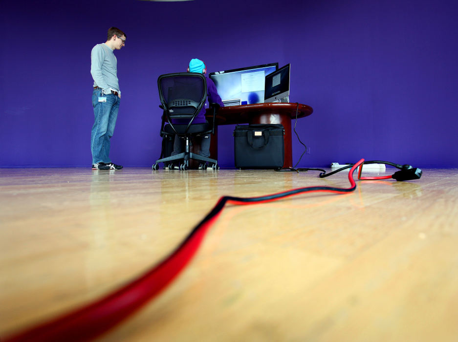 Second Place, Photographer of the Year - Large Market - Lisa DeJong / The Plain DealerExplorys system technicians Luke Teeters, left, and Josh Spector,  work on a set of computers in a sparse room at their new start-up company called Explorys. Many new start-ups are calling Cleveland home. Explorys is pioneering Big Data in the health-care field and giving Cleveland a lead in a new industry. Its software mines patient records to spy patterns and trends and offer treatment options to doctors and nurses. Its booming. 