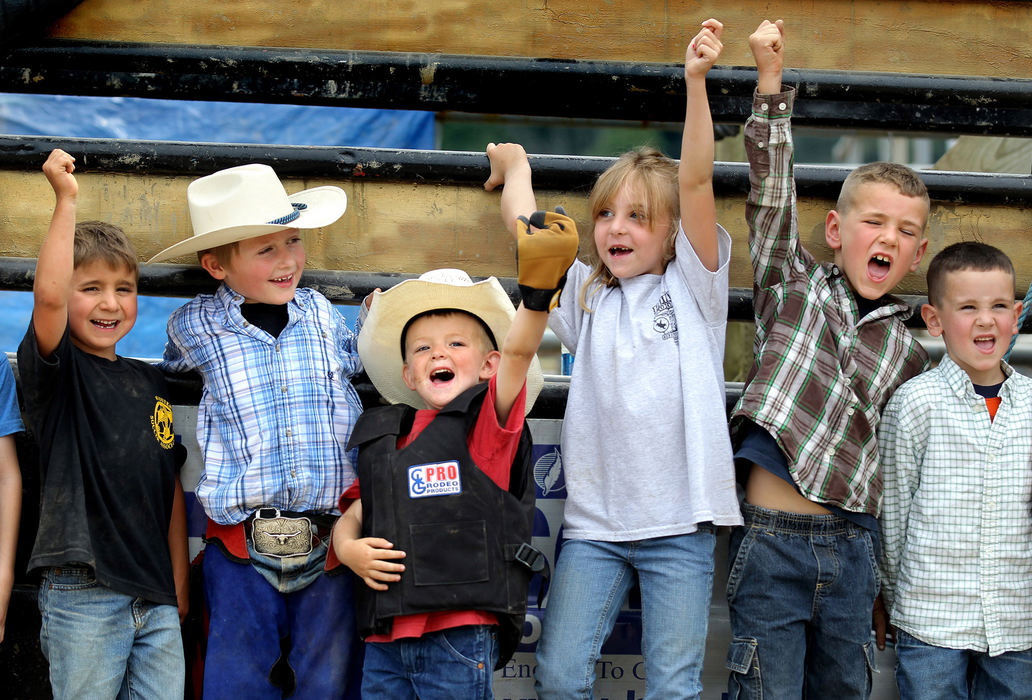 Second Place, Photographer of the Year - Large Market -  Lisa DeJong / The Plain DealerThey lived. The wee wranglers, 5-9, cheer after being congratulated on completing the mutton bustin' school lessons at Buckin' Ohio at Creek Bend Ranch. All have signed up for next lessons which are held next summer.  From left is Thomas Foster, 6, of Wooster; Riley McCullough, 6, of Willard; Ace Thorsell, 4, of Burbank; Carly Baxter, 7, of Edinburgh; Josh Chirdon, 6, and Zach Chirdon, 5, of Wadsworth. 