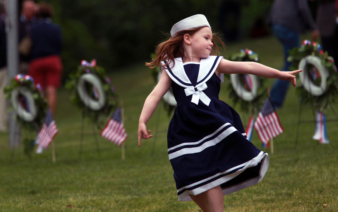 , Photographer of the Year - Large Market - Gus Chan / The Plain DealerMadeline Power, 5, of Cleveland, dances to the music of the Cleveland Letter Carriers Band at the Memorial Day Program at Lake View Cemetery.