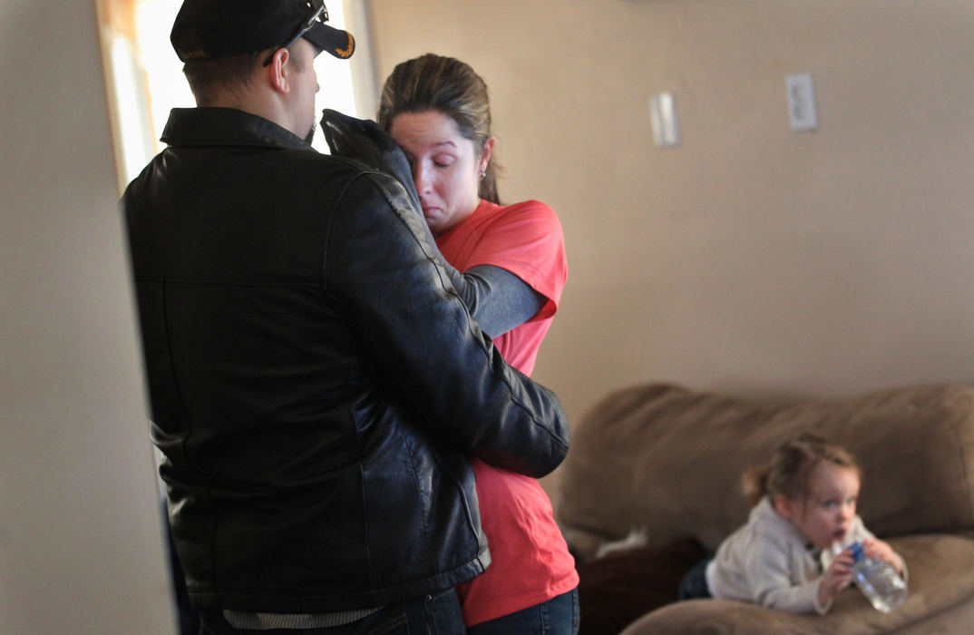 , Photographer of the Year - Large Market - Gus Chan / The Plain DealerLyndsay Glenn wipes back tears as her husband, Jimmy, says goodbye before heading to Cincinnati to enter a treatment program.  Glenn was headed to an eight week inpatient treatment program to combat his Post Traumatic Stress Disorder, or PTSD.