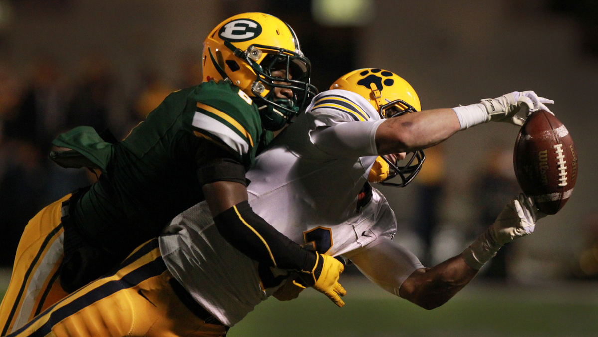 , Photographer of the Year - Large Market - Gus Chan / The Plain DealerSt. Ignatius wide receiver Jack Hyland tries to make a fingertip grab on a third down play while being defended by St. Edward defensive back D.J. Thomas.