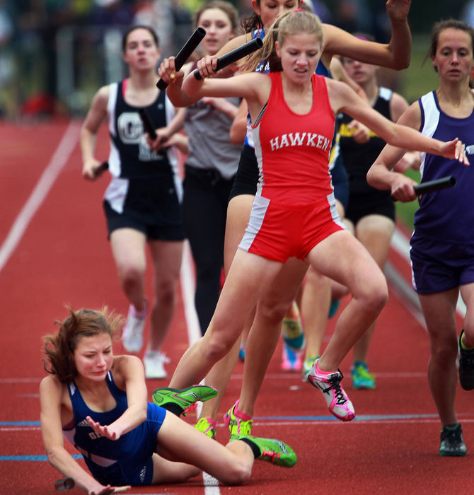 , Photographer of the Year - Large Market - Gus Chan / The Plain DealerGilmour Academy's Hannah Markel, left, falls after being tripped by Hawken's Emily Staufer during the second leg of the 4X800 Division II state finals.  Gilmour finished sixth and Hawken's relay was disqualified.