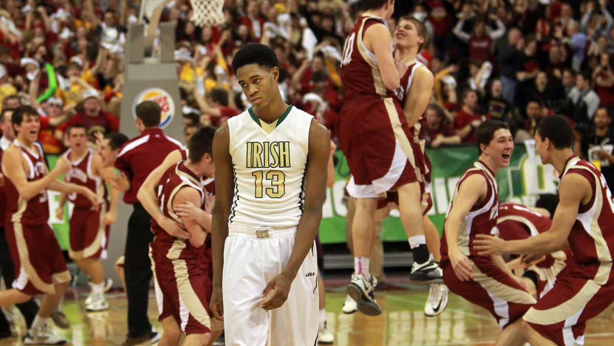 , Photographer of the Year - Large Market - Gus Chan / The Plain DealerDejected St. Vincent-St. Mary guard VJ King walks off the court as the Bishop Watterson team celebrates their 55-52 state final win in Division II.