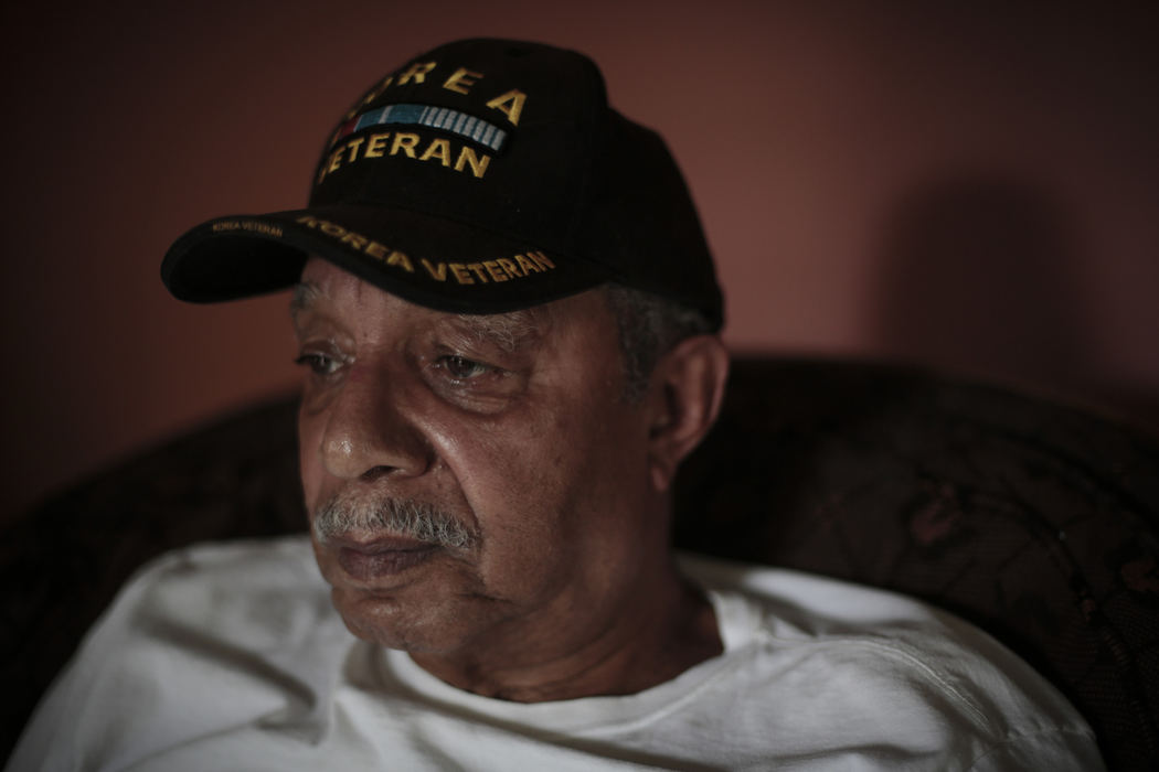 First Place, Photographer of the Year - Small Market - Joshua A. Bickel / ThisWeek Community NewsKorean War veteran Clifton Davis poses for a portrait May 17, 2013 at his home in Worthington, Ohio. Davis, a native of Delaware, Ohio, served in an infantry regiment and later as a quartermaster in an integrated regiment of the U.S. Army. The Westerville Rotary club will honor Davis during its Field of Heroes event later in May.