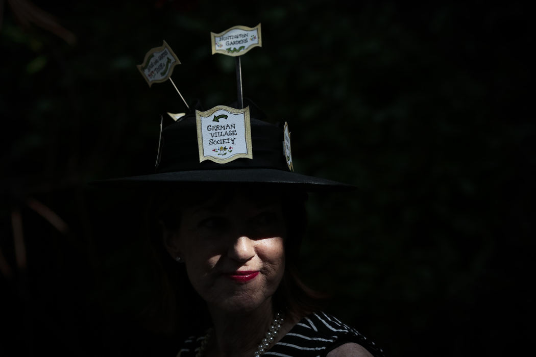 First Place, Photographer of the Year - Small Market - Joshua A. Bickel / ThisWeek Community NewsBetsy DeFusco wears a custom hat featuring German Village landmark signs for the hat contest during "Tea 4 2: Two-Hundred for Tea,"  Aug. 17, 2013 at the German Village Guesthouse in Columbus, Ohio. The party was a fundraiser for the German Village Society, which hopes to create actual signs that would then be placed around the historic Columbus neighborhood for visitors.