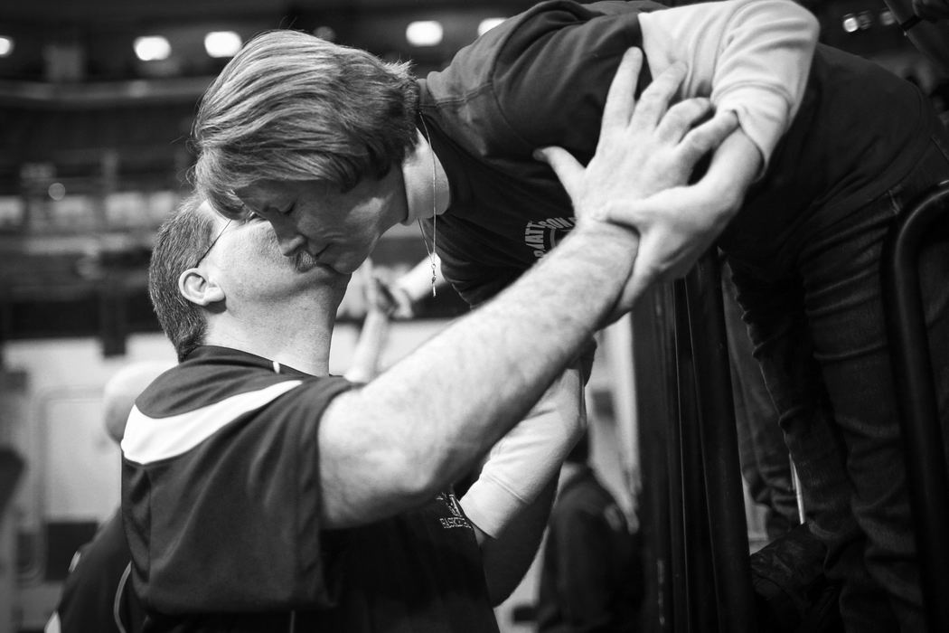 First Place, Photographer of the Year - Small Market - Joshua A. Bickel / ThisWeek Community NewsBishop Watterson head coach Vince Lombardo kisses his wife, Cathy, as he walks into Value City Arena for Watterson's state final against Akron St. Vincent-St. Mary Mar. 23, 2013  in Columbus, Ohio.