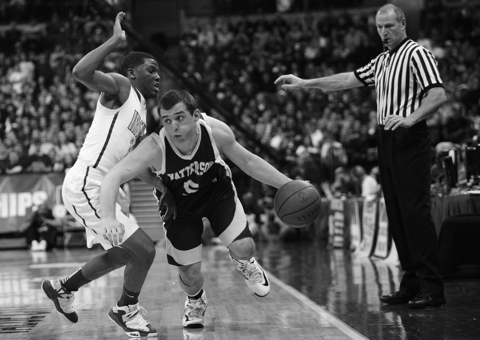 First Place, Photographer of the Year - Small Market - Joshua A. Bickel / ThisWeek Community NewsBishop Watterson's Cody Calhoun, center, works his way around St. Vincent-St. Mary's Jarel Woolridge, left, during Watterson's state final against Akron St. Vincent-St. Mary Mar. 23, 2013 at Value City Arena in Columbus, Ohio.