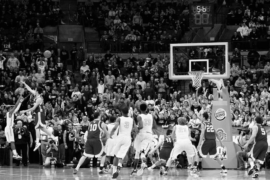 First Place, Photographer of the Year - Small Market - Joshua A. Bickel / ThisWeek Community NewsBishop Watterson's Matt Hughes, left, defends as St. Vincent-St. Mary's Fransohn Bickley (4) attempts a game-tying three-pointer in the final seconds of Watterson's state final against Akron St. Vincent-St. Mary Mar. 23, 2013 at Value City Arena in Columbus, Ohio.