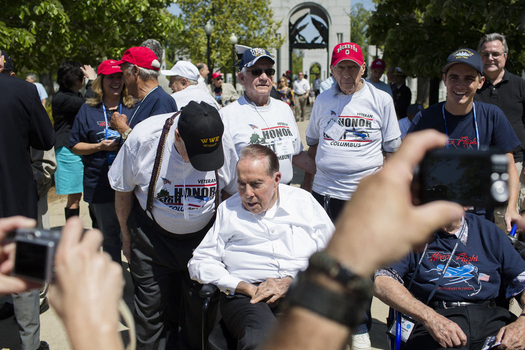 First Place, Photographer of the Year - Small Market - Joshua A. Bickel / ThisWeek Community NewsWorld War II veteran Tennison Williams, left, of Columbus, Ohio, speaks with retired U.S. Sen. Bob Dole (R-Kan.) before posing with a picture with the 89-year-old senator Apr. 27, 2013 at the World War II Memorial in Washington, D.C. Sen. Dole led the fundraising effort for the construction of the memorial and serves as its national chairman. When he is able, Sen. Dole comes to the memorial to speak with veterans visiting as part of Honor Flights.