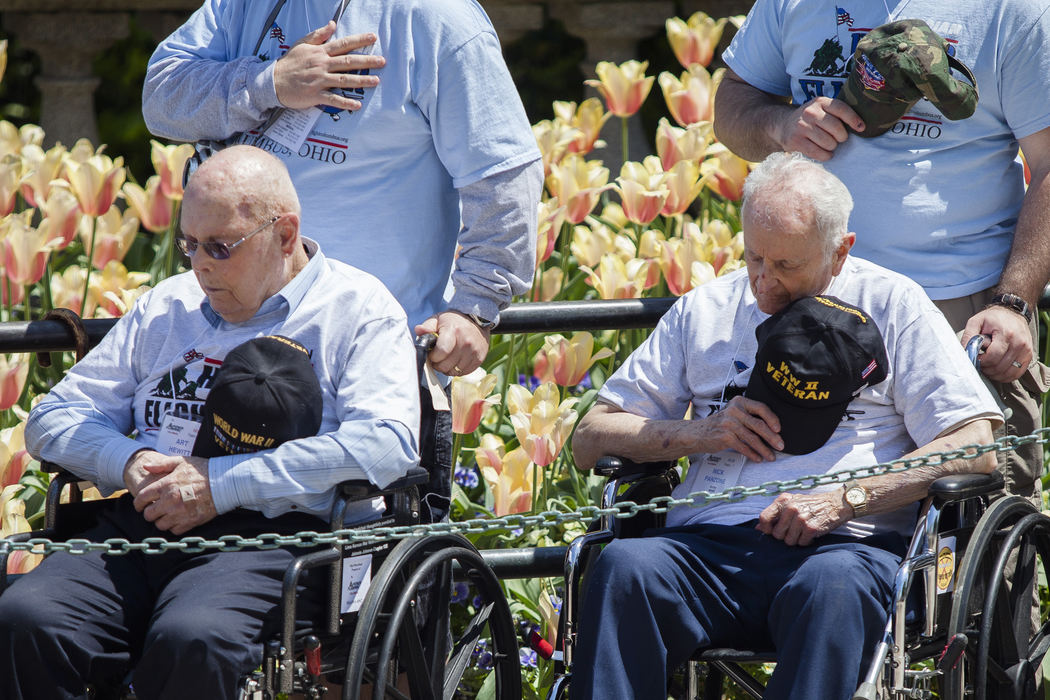 First Place, Photographer of the Year - Small Market - Joshua A. Bickel / ThisWeek Community NewsWorld War II veterans Art Hewitt, left, of Nelsonville, Ohio, and Nick Panzone, right, of Columbus, Ohio, place their hands over their hearts during the Changing of the Guard Apr. 27, 2013 at Arlington National Cemetary in Washington, D.C. The pair, along with more than 70 World War II and Korean War veterans, visited D.C. as part of Honor Flight Columbus.