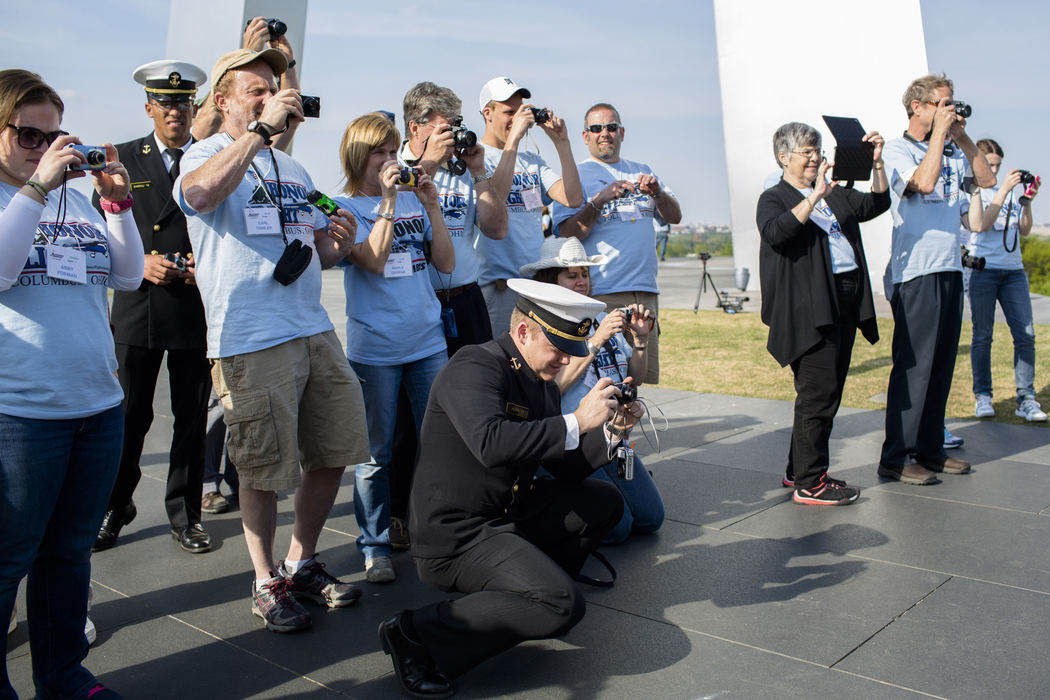 First Place, Photographer of the Year - Small Market - Joshua A. Bickel / ThisWeek Community NewsNavy Midshipman 2nd Class Cody Horr, center, of Houston, leans down to snap a picture with other Honor Flight guardians as veterans pose for a picture Apr. 27, 2013 at the Air Force Memorial in Washington, D.C.