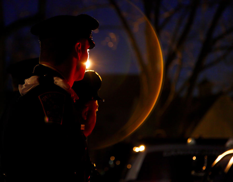 Second Place, Photographer of the Year - Small Market - Barbara J. Perenic / Springfield News-SunAn honor guard waits outside for the hearse to arrive before a memorial service for the city Police Division's K-9 officer, Rambo. Rambo's watch ended January 31st, 2013, after a battle with cancer. Rambo is survived by his partner Officer Michael Fredendall. 