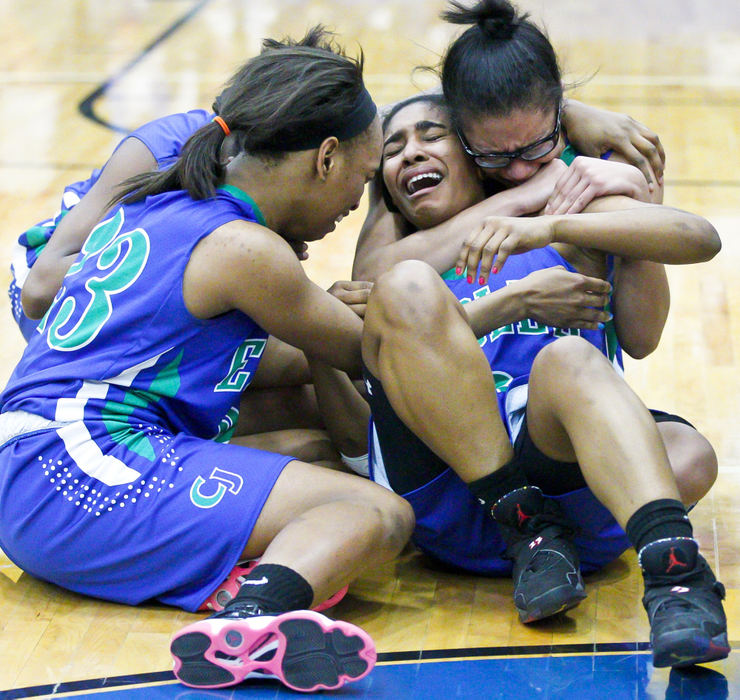 Second Place, Photographer of the Year - Small Market - Barbara J. Perenic / Springfield News-SunChaminade-Julienne basketball players Erinn Bailey (23), Krista White (11),  Brittaney Jefferson (3) and JaCole Tabor (22) celebrate a 47-45 win over Carroll in overtime during Friday's Division II regional final basketball game.