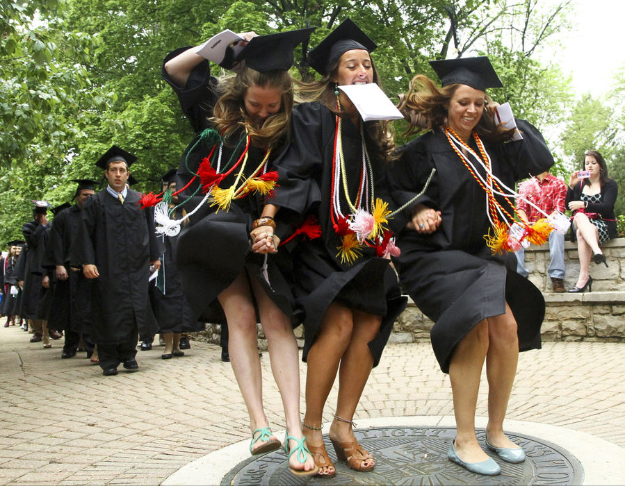 Second Place, Photographer of the Year - Small Market - Barbara J. Perenic / Springfield News-SunGraduating Wittenberg University students jump on the school's seal in celebration of finishing their degrees before proceeding to Commencement Hollow for their ceremonial exercises.