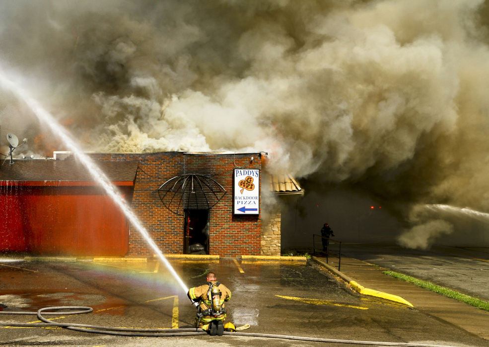 Second Place, Photographer of the Year - Small Market - Barbara J. Perenic / Springfield News-SunThe Springfield Fire Rescue Division battled a two-alarm fire in the structure housing McMurray’s Irish Pub, Paddy’s Backdoor Pizza and Carmae Catering.