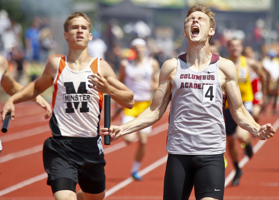 Second Place, Photographer of the Year - Small Market - Barbara J. Perenic / Springfield News-SunBeating Korey Schultz of Minster to the line, John Lint of Gahanna Columbus Academy reacts with a yell to a win in the Division III 4x400 meter relay, during the OHSAA state track and field championships in Columbus.