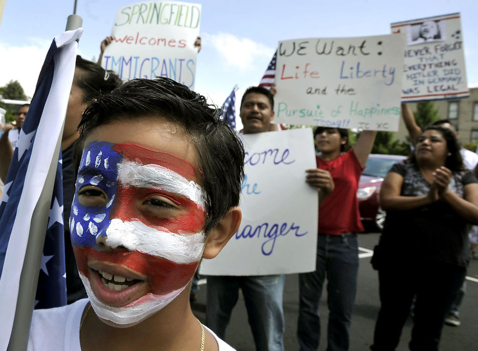 Third Place, Photographer of the year - Small Market - Bill Lackey / Springfield News-SunJames Hernandez, 9, chants along with a crowd of several hundred immigration reform supporters who turned out for a march to Speaker of the House John Beohner's Springfield office to demand that he offer a pathway to citizenship for illegal immigrants. 