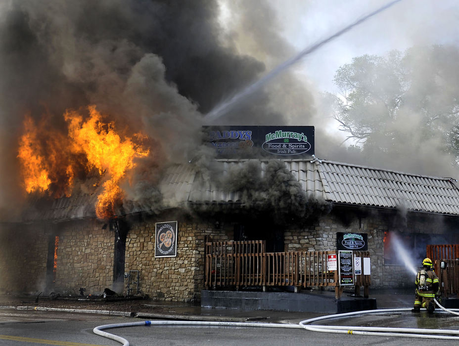 Third Place, Photographer of the year - Small Market - Bill Lackey / Springfield News-SunMembers of the Springfield Fire Division battle a two alarm fire at McMurray's Irish Pub Friday, June 8, 2013. The popular restaurant and bar at 122 E. College Ave. was completely destroyed by the fire.