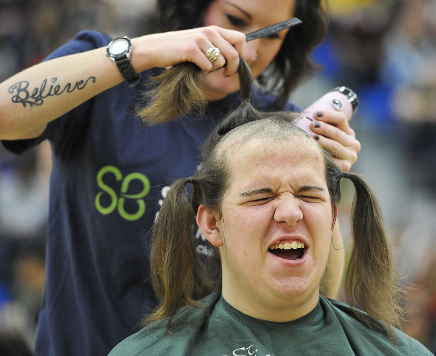 Third Place, Photographer of the year - Small Market - Bill Lackey / Springfield News-SunMatthew Puckett, a junior at Springfield High School, reacts as Megan Ehalt shaves his head in the school gym during a pep rally Friday. Nearly $4,000 was raised for childhood cancer research as nine male students at the school got their heads shaved for the St. Baldrick's Foundation.