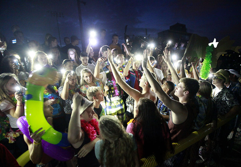 Third Place, Photographer of the year - Small Market - Bill Lackey / Springfield News-SunFootball fans in the Shawnee student section use their cell phones to light up the stands as they have fun while they wait for the lights to come back on Friday at the Braves' homecoming game against Kenton Ridge. The power went out suddenly, stopping the game for about a half hour until the lights came back on.