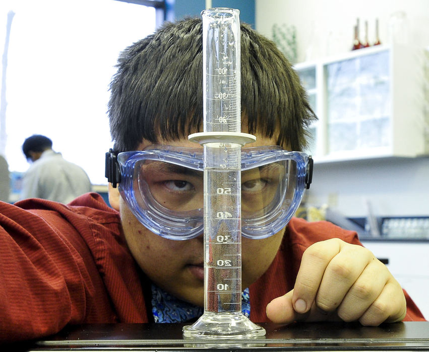 Third Place, Photographer of the year - Small Market - Bill Lackey / Springfield News-SunEric Ortiz checks the amount of water he's using in a science experiment. Eric is a freshman a STEM school in columbus that focuses on science and technology. 