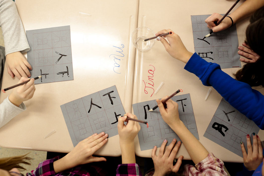 First Place, Photographer of the Year - Small Market - Joshua A. Bickel / ThisWeek Community NewsPark Street students draw Chinese characters using special pens and paper during a lesson about the Chinese language taught by visiting teachers from Hong Kong Feb. 7, 2013 at Park Street Intermediate School in Grove City, Ohio.