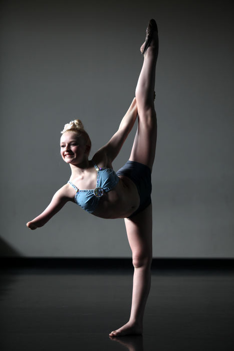 Award of Excellence, Portrait Personality - Courtney Hergesheimer / The Columbus DispatchLexi Daniels, 13-year-old dancer who plans to audition when the America's Got Talent show comes to Columbus. Daniels was born with no right arm below the elbow, but her talent and passion for dancing have drawn rave reviews. Pictured at her dance studio, North Point Dance Academy in Lewis Center.