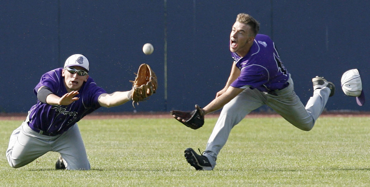 First Place, Sports Action - Scott Heckel / The (Canton) RepositoryTriway's Greg Hamlin (left) and Jordon Miller (right) dive for a ball hit off the bat of Alliance's Hunter Cannon during the third inning of their D2 district semifinal game at Thurman Munson Stadium in Canton. Both were unable to make the catch on the play.