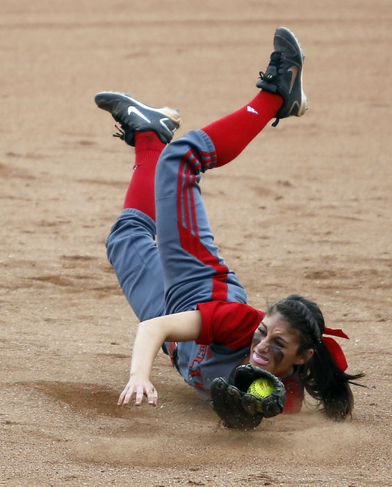 Award of Excellence, Sports Action - Sam Greene / The (Lisbon) Morning JournalShortstop Marie Masters makes a diving catch for the third out in the bottom of the first inning of the OHSAA D-I State Final game between the Elyria High School Pioneers and the North Canton Hoover Vikings at Firestone Stadium in Akron. The Vikings won their third-consecutive, and the school's seventh, state title with a 7-0 win over the Pioneers. 