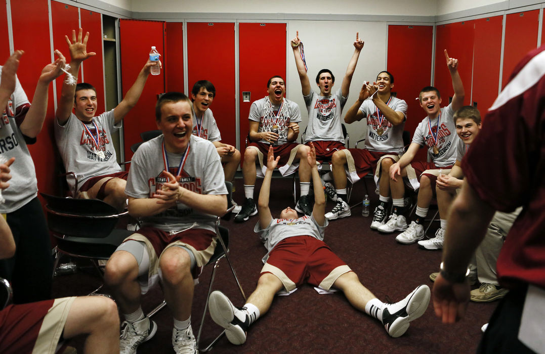Award of Excellence, Sports Feature  - Eric Albrecht / The Columbus DispatchBishop Watterson basketball players who just won a state championship over Akron St. Vincent St. Mary start celebrating  as their head coach Vince Lombardo enters the locker room after the game.