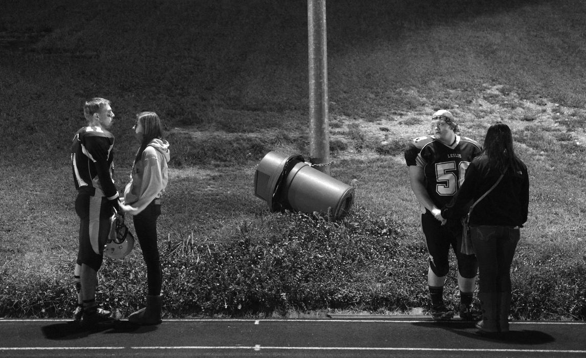 Award of Excellence, Sports Feature  - Jenna Watson / Kent State UniversityPlayers share a moment with their dates as they exit from a rough loss to the Bobcats in Hyden, Ky..