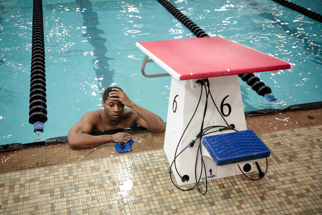 First Place, Ron Kuntz Sports Photographer of the Year - Joshua A. Bickel / ThisWeek Community NewsBishop Hartley's Ronnie Bolden reacts after his third-place performance during the men's 100-yard butterfly during the OSHAA Division II swimming finals Feb 22, 2013 at C.T. Branin Natatatorium in Canton, Ohio. Bolden held the lead for much of the race, falling behind in the final length.