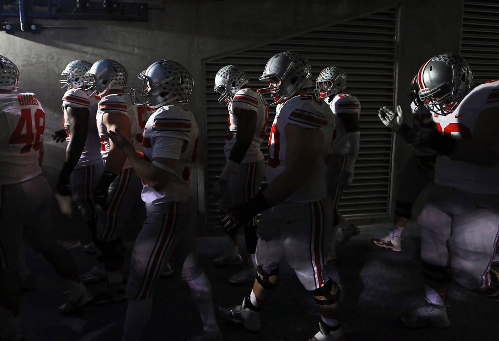Second Place, Ron Kuntz Sports Photographer of the Year - Adam Cairns / The Columbus DispatchOhio State football players wait to enter the field prior to the first quarter of the Big Ten championship football game against the Michigan State Spartans at Lucas Oil Stadium in Indianapolis on Dec. 7, 2013. (Adam Cairns / The Columbus Dispatch)