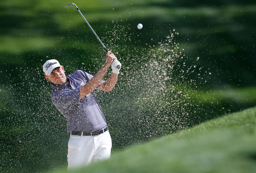 Second Place, Ron Kuntz Sports Photographer of the Year - Adam Cairns / The Columbus DispatchBill Haas chips out of the bunker on the 8th hole during the second round of the Memorial Tournament at Muirfield Village Golf Club in Dublin, Ohio on May 31, 2013. Haas shot a 5-under-par for the day. 
