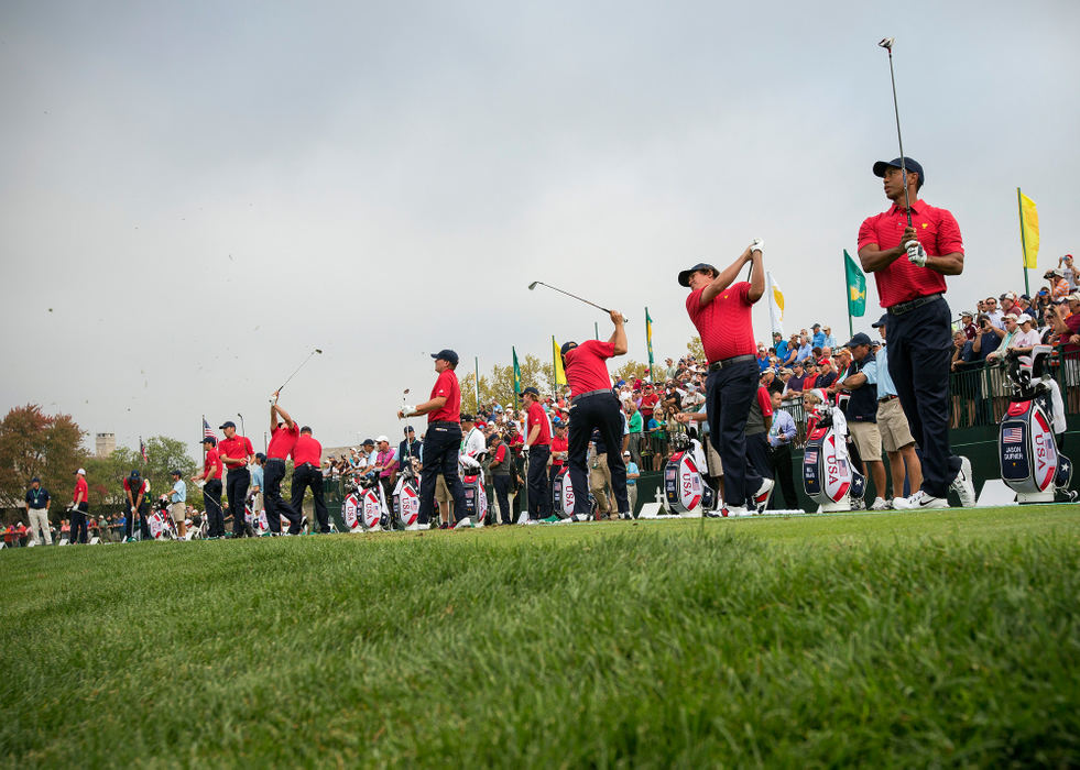 Second Place, Ron Kuntz Sports Photographer of the Year - Adam Cairns / The Columbus DispatchThe United States Team warms up on the driving range prior to a practice round for the Presidents Cup at Muirfield Village Golf Club on Oct. 2, 2013. 