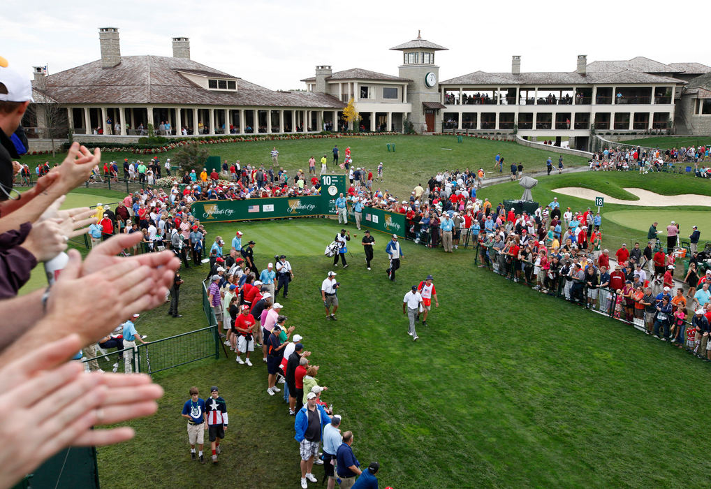 Second Place, Ron Kuntz Sports Photographer of the Year - Adam Cairns / The Columbus DispatchFans watch Tiger Woods of the United States Team after his tee shot on the 10th hole during the final round of the Presidents Cup at Muirfield Village Golf Club on Oct. 6, 2013.