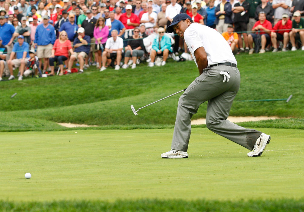 Second Place, Ron Kuntz Sports Photographer of the Year - Adam Cairns / The Columbus DispatchTiger Woods of the United States Team squirms as his putt just misses the cup on the 14th hole during the final round of the Presidents Cup at Muirfield Village Golf Club on Oct. 6, 2013.