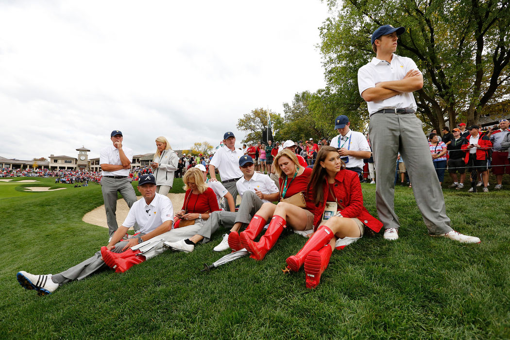 Second Place, Ron Kuntz Sports Photographer of the Year - Adam Cairns / The Columbus DispatchUnited States players and their girlfriends and wives wait for the final golfers to approach the 18th green during the final round of the Presidents Cup at Muirfield Village Golf Club on Oct. 6, 2013. 