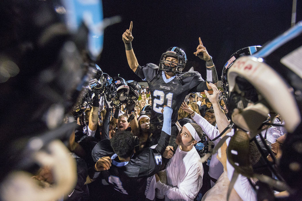 Third Place, Ron Kuntz Sports Photographer of the Year - Jabin Botsford / Western Kentucky UniversityHilliard Darby senior running back Hunter McSweeney is hoisted into the air as he celebrates with teammates and fans after a football game at Hilliard Darby High School in Columbus, Ohio on Thursday, Nov. 01, 2013.